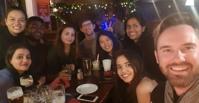 A group of students sitting in a bar