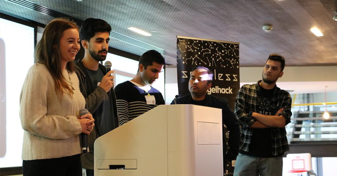 Students present on a podium