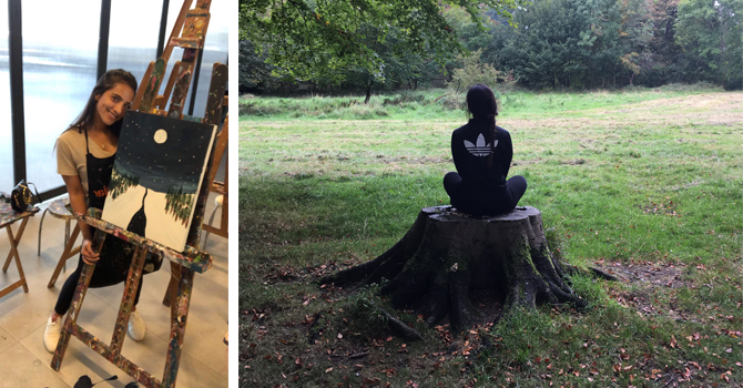 Student standing beside her painting of a moonscape and the same student sitting on a tree trunk, doing yoga