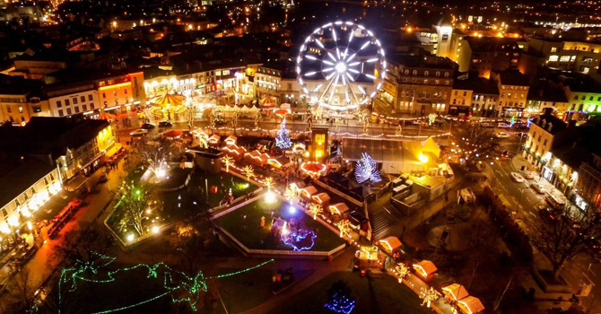 The city of Galway at night, taken from above, lit up with lights