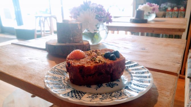 vegan cake on a blue and white patterned china plate 