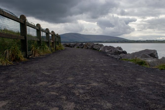 coastal path with mountain in background 