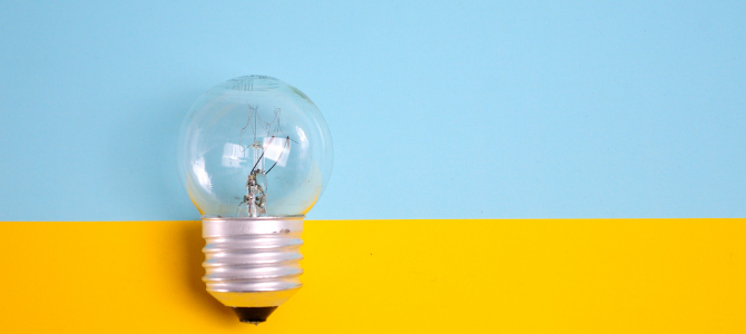 lightbulb against a blue and yellow background