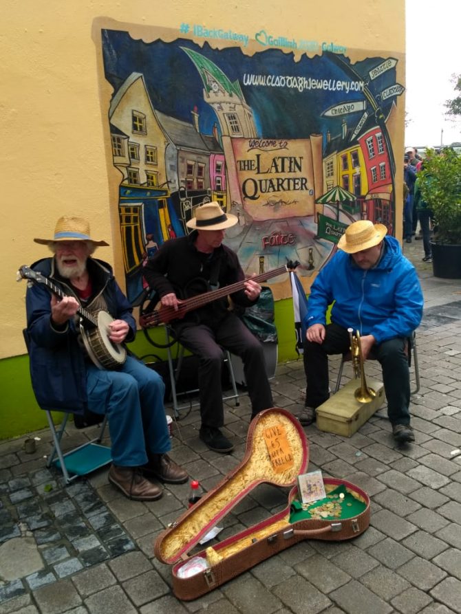 street performers with traditional Irish instruments 