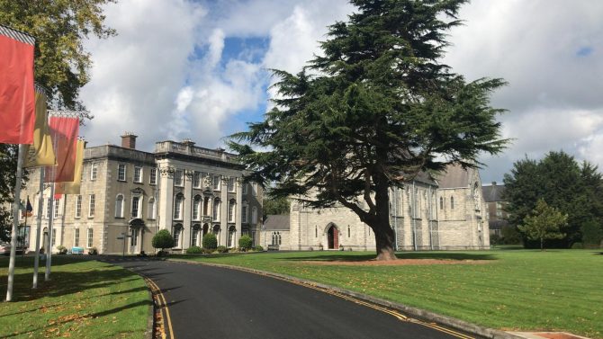 Stately home with pathway and trees 