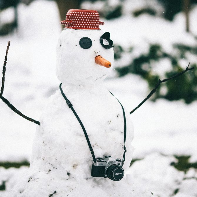 snowman wearing a camera