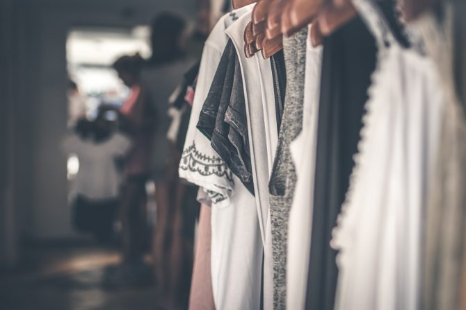 clothes lined up on a rack 