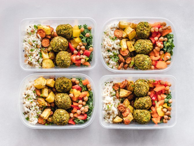 four containers of meals demonstrating meal prepping 