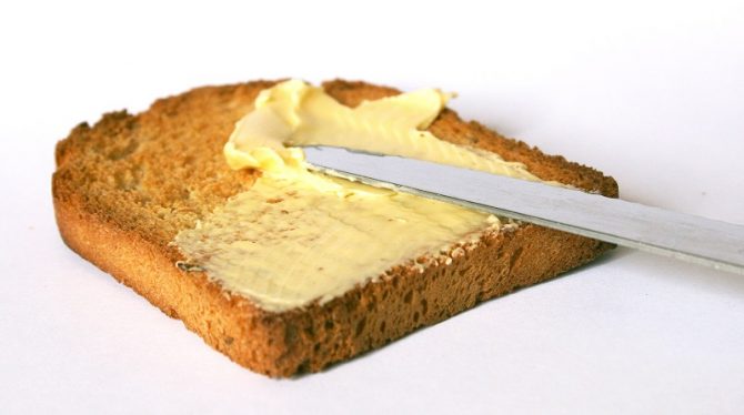 slice of toast being buttered 
