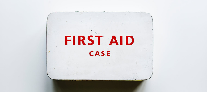 red and white first aid case